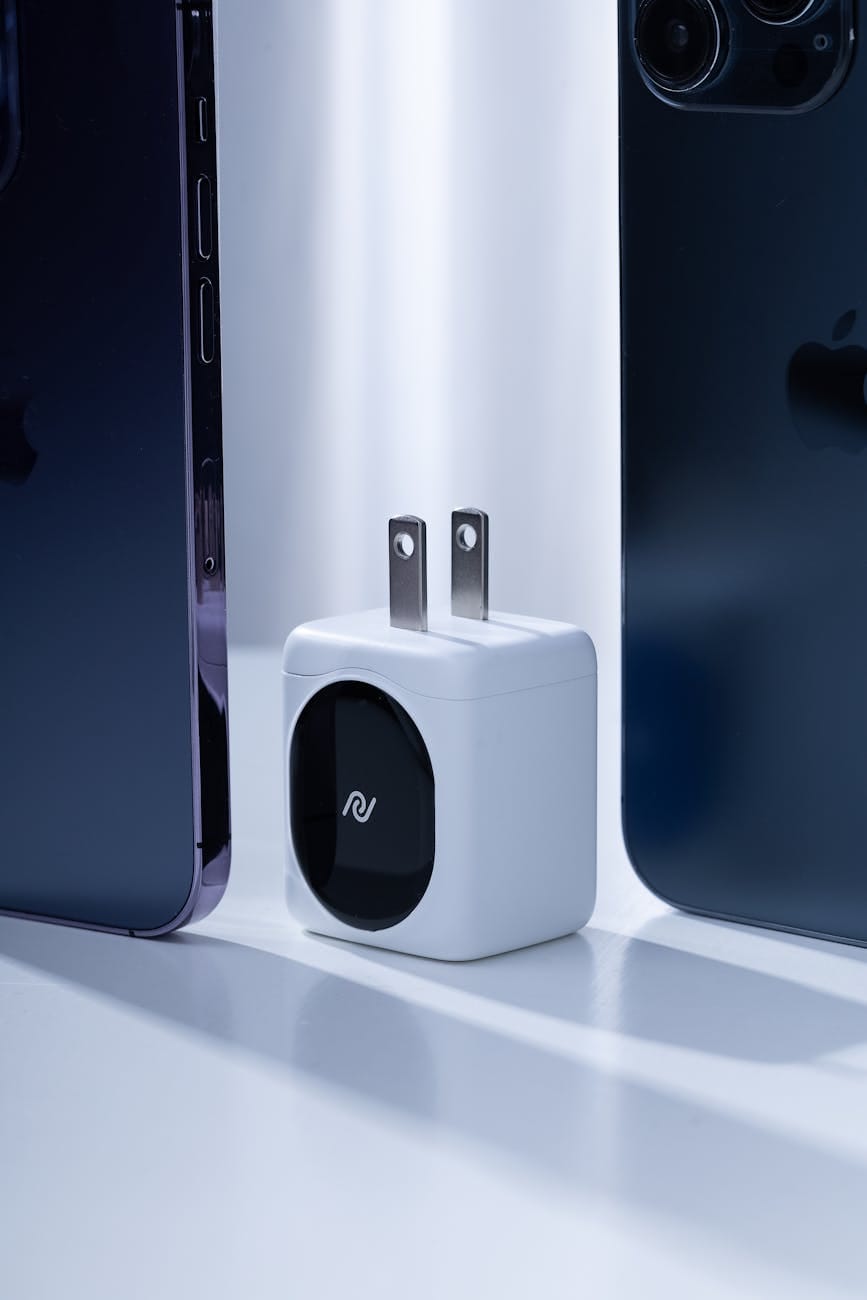 What Are The Best Travel Gadgets For Stress-Free Exploration? 2 smartphones and charger best travel gadgets