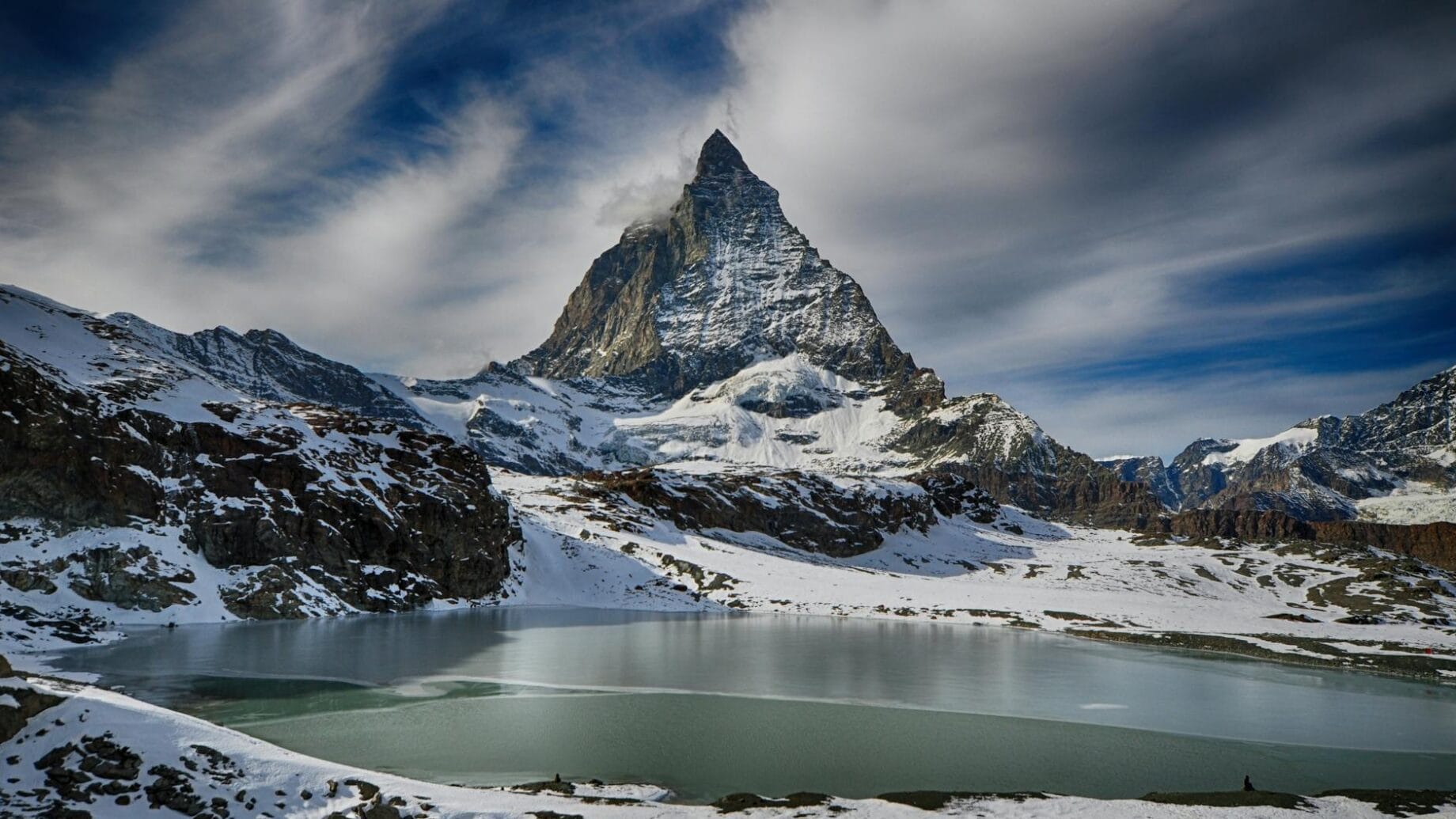 white mountain under gray sky