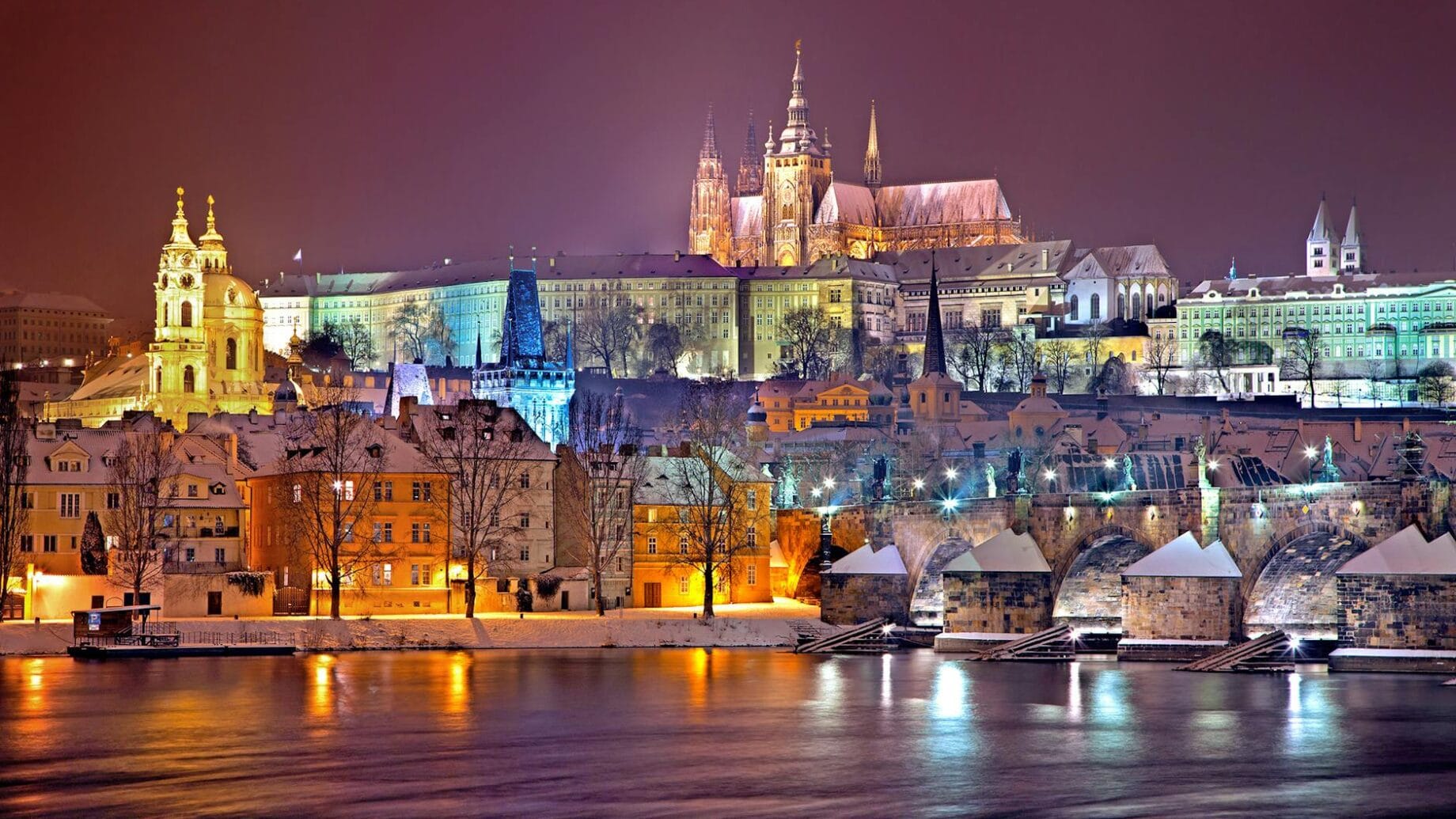 prague castle district lit up at night